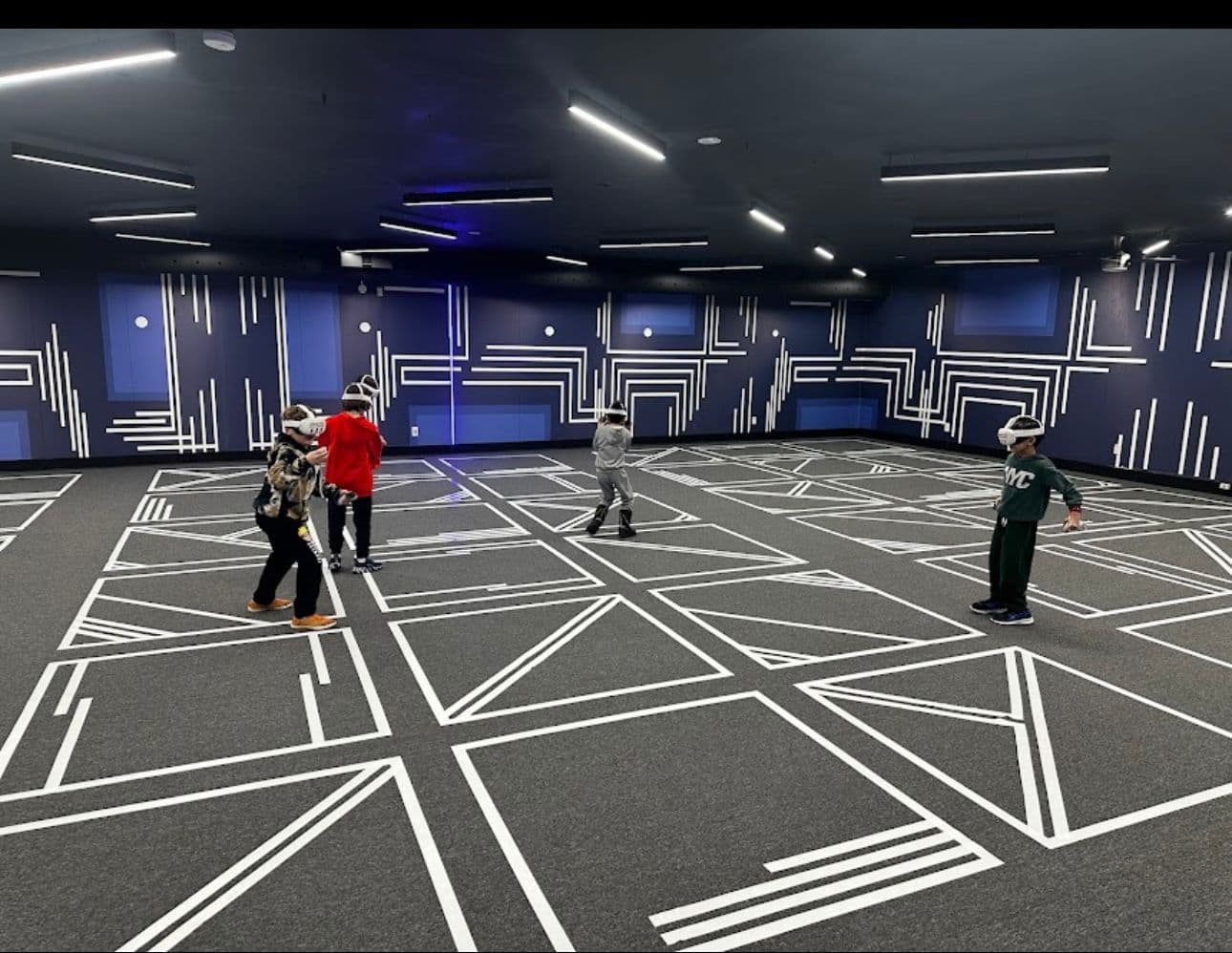 Kids playing free-roam VR in the Another World arena