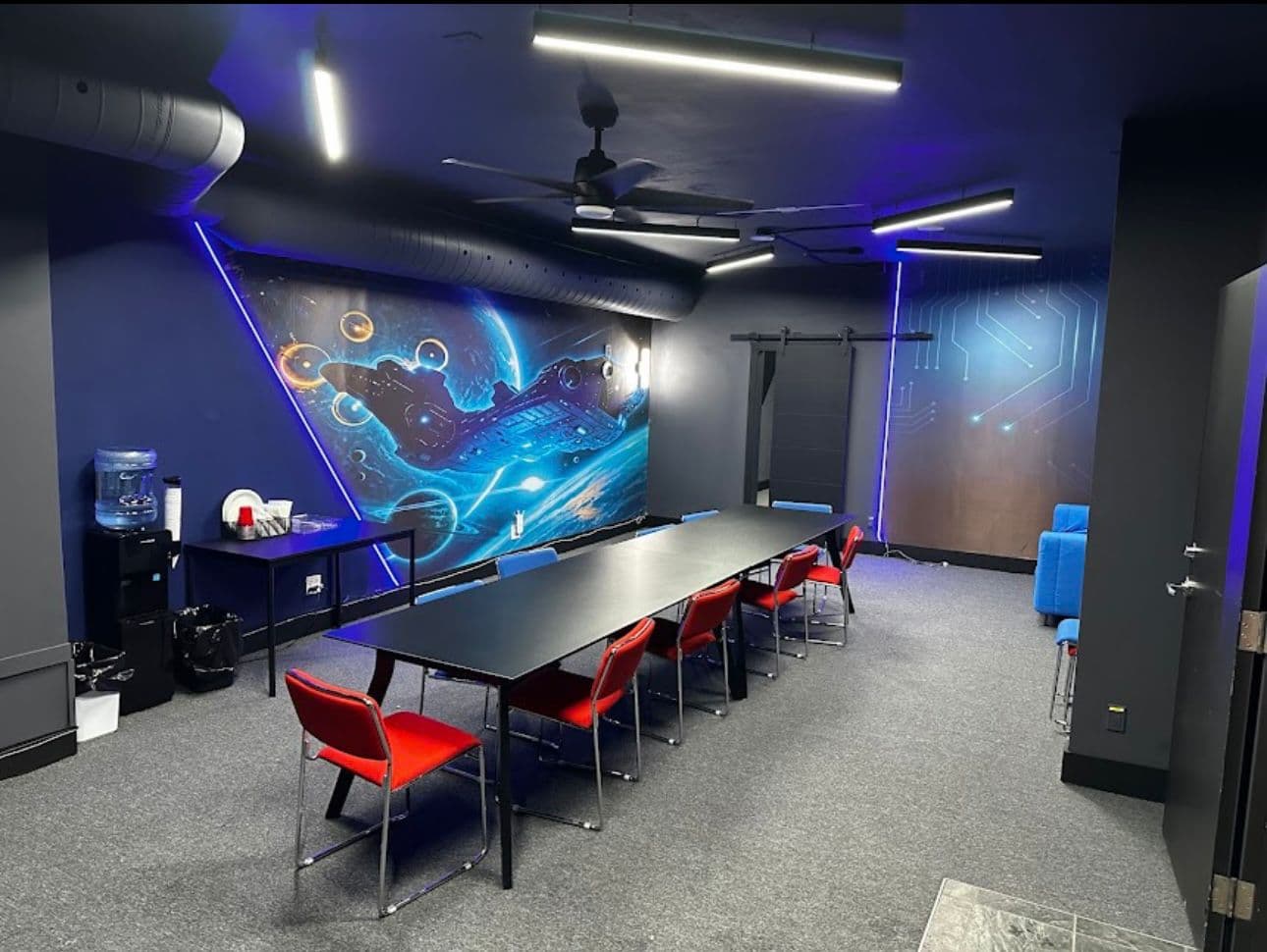 Private event room with space mural and conference table