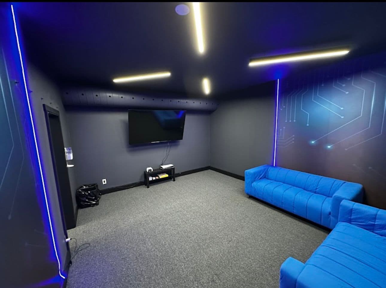 Private event lounge with blue sofas for intimate celebrations
